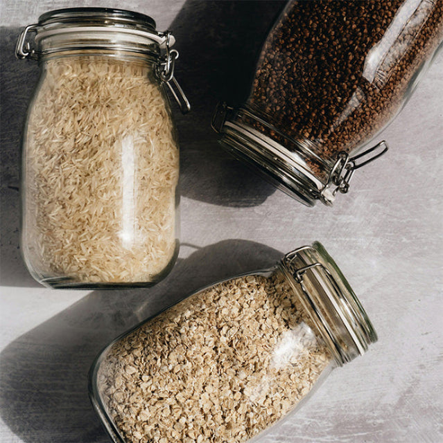 Overhead images of glass preserving jars filled with food items